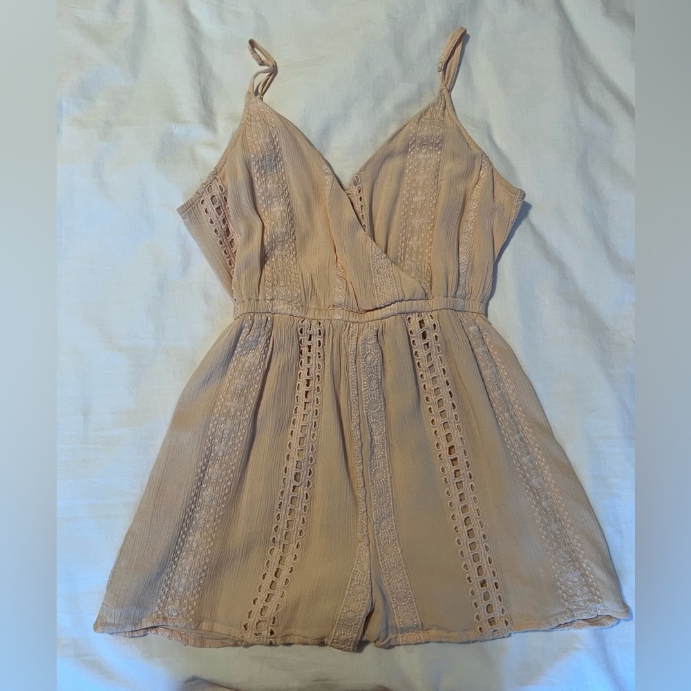 Light pink romper.